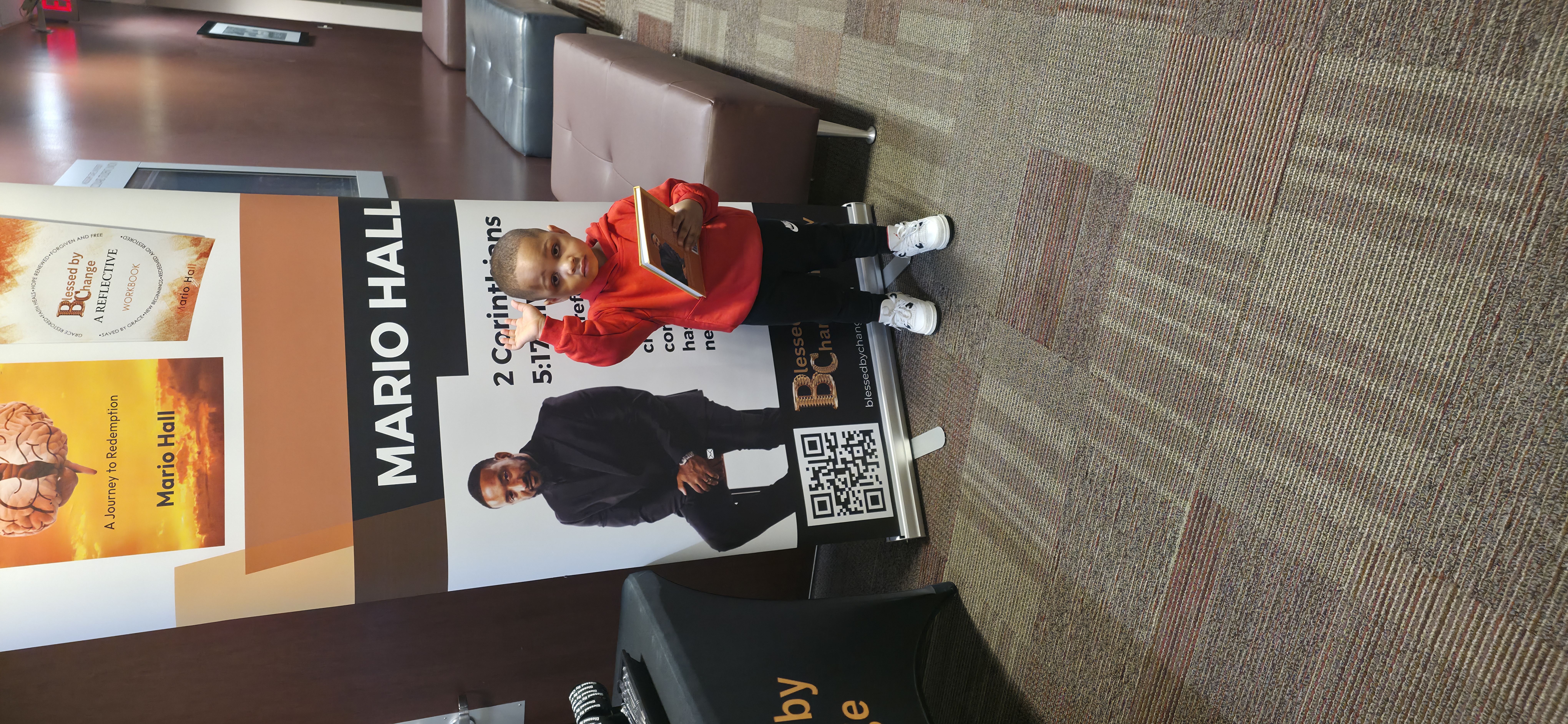 Young reader with Blessed By Change book